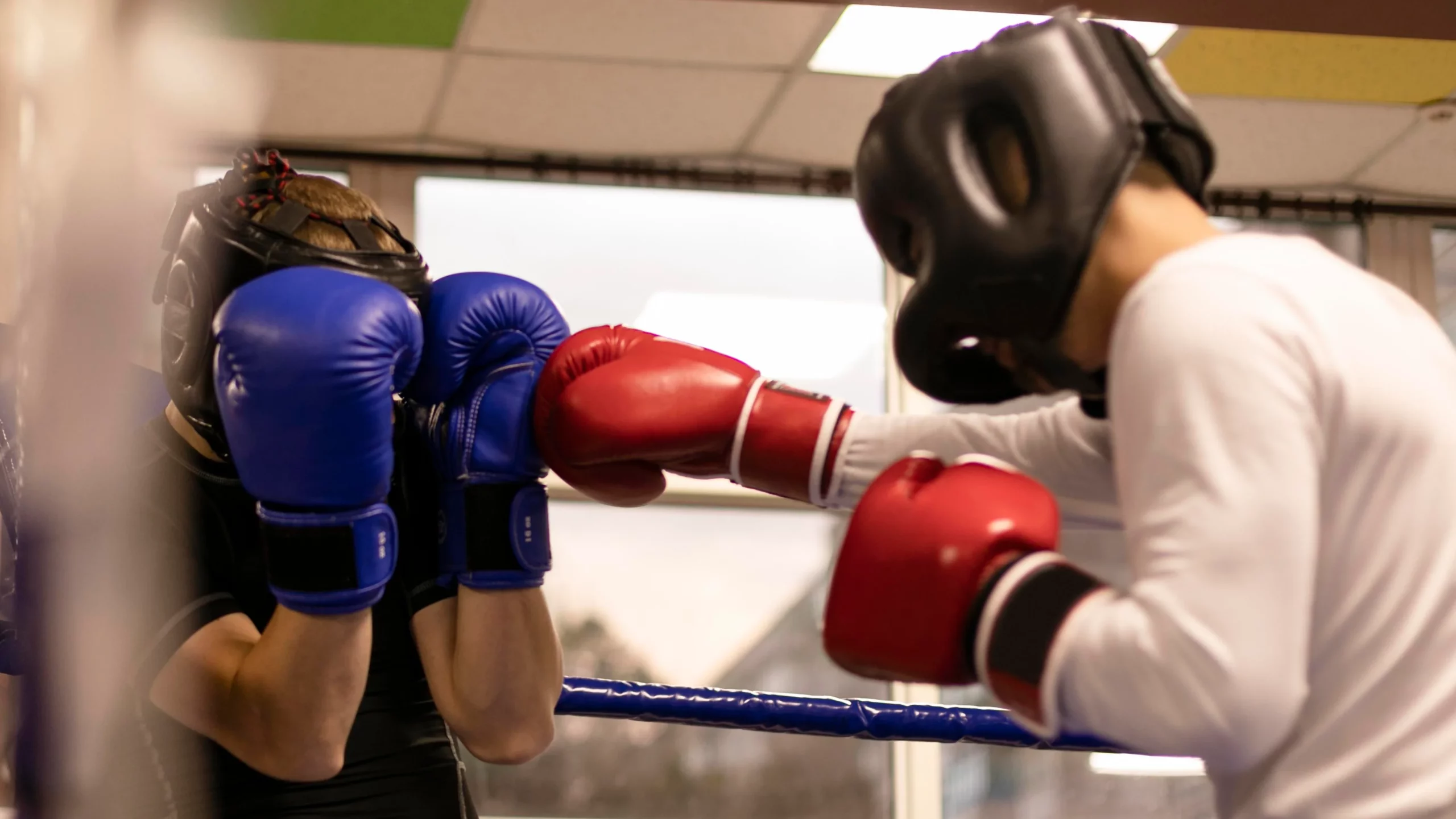 side view male boxer with helmet practicing ring scaled